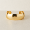 Polished pale gold cuff bracelet with consistent square product-card framing