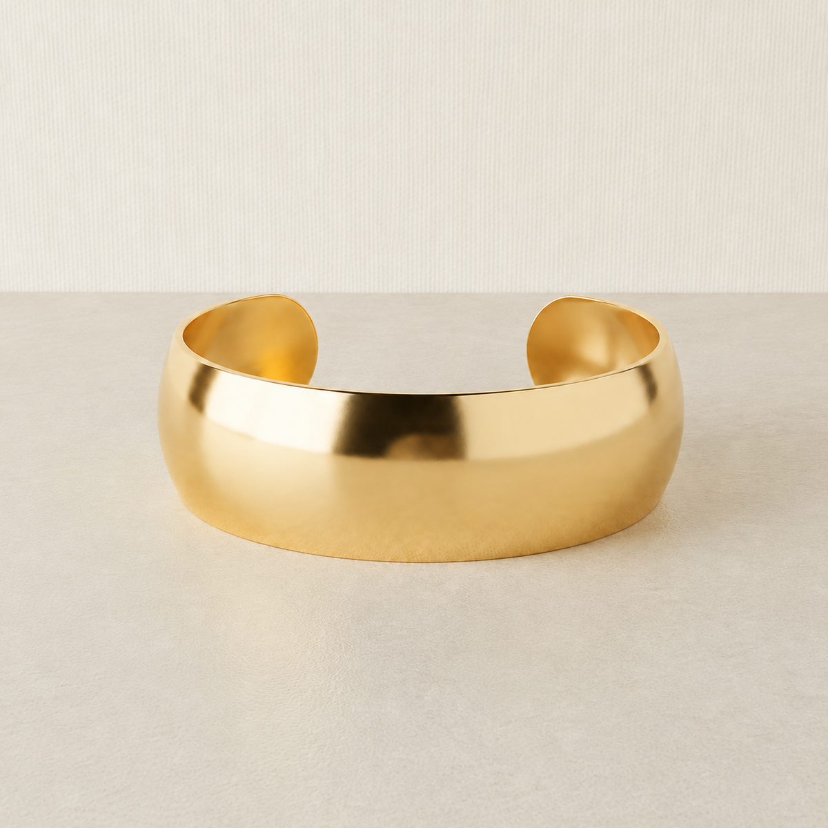 Polished pale gold cuff bracelet with consistent square product-card framing